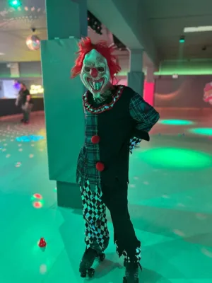 Someone dressed as a clown on roller skates